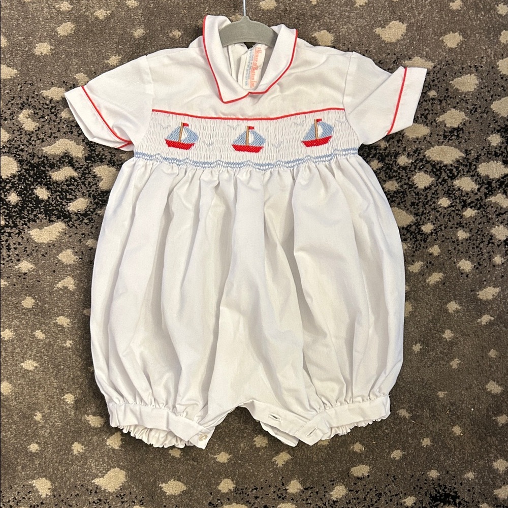White Baby Romper with Sailboat Smocking Detail